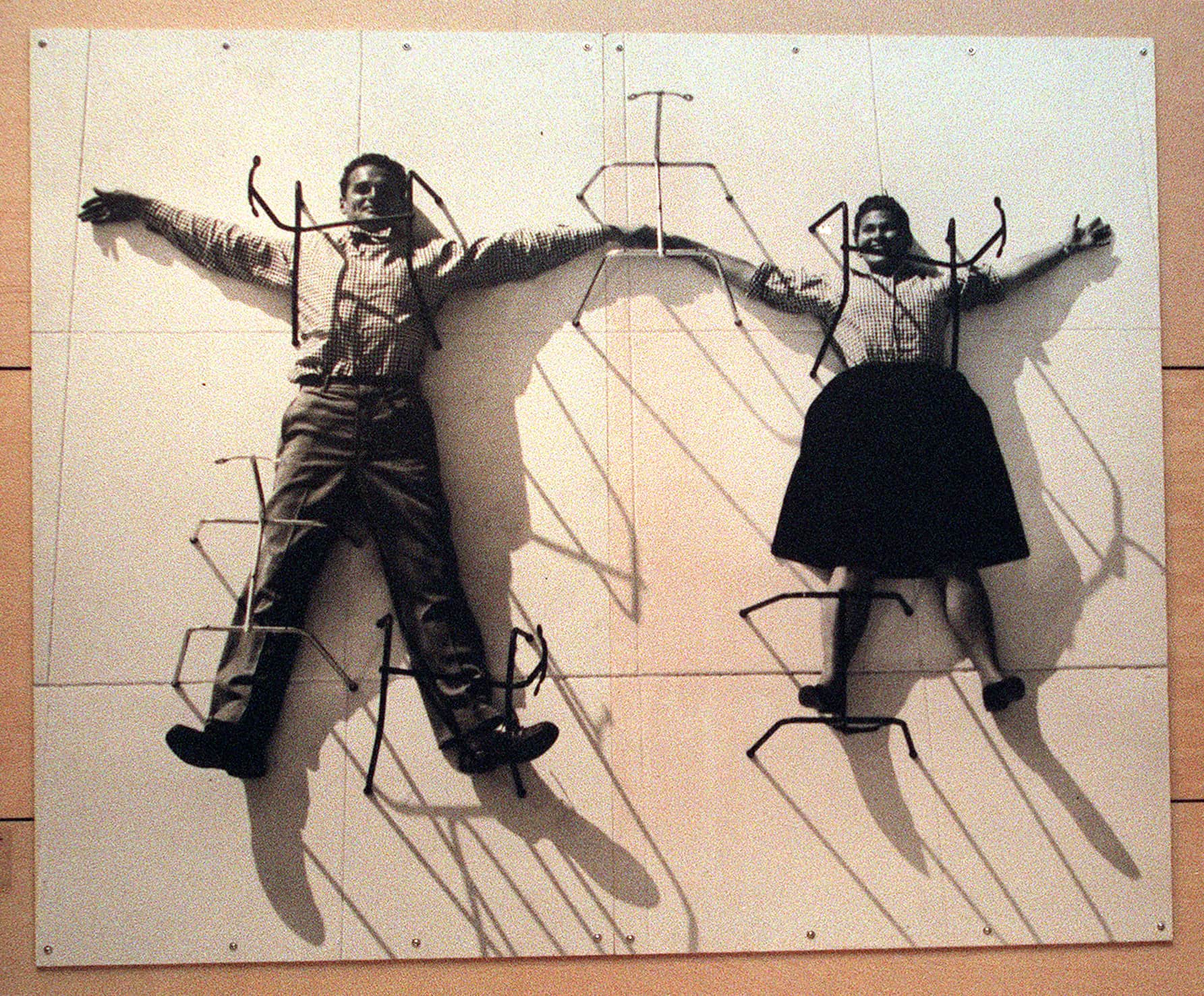 Photo mural of Charles and Ray Eames on exhibit at LACMA